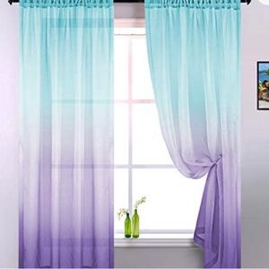 Ombré lilac and turquoise curtains.